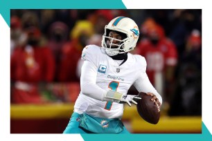 Dolphins quarterback Tua Tagovailoa drops back to throw a pass.