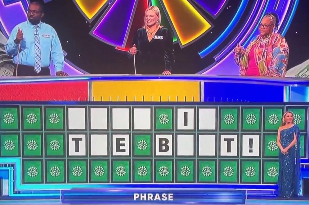 A group of people participating in the Wheel of Fortune game show, making an obscene guess