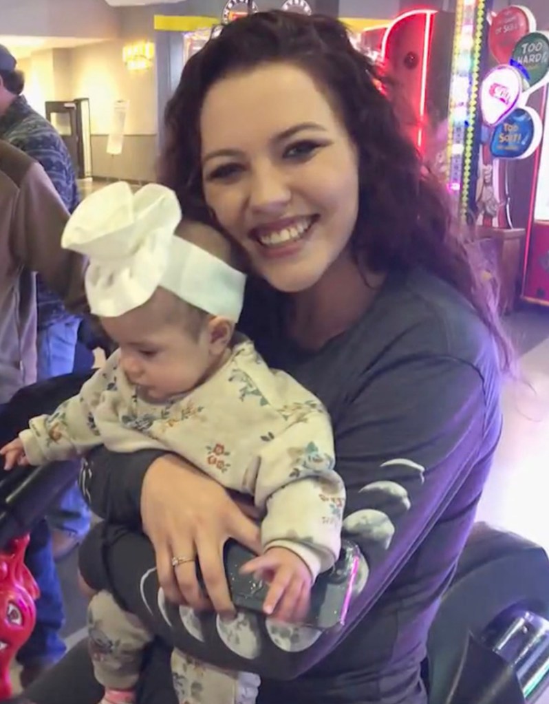 Samantha Cisneros hugging her toddler.
