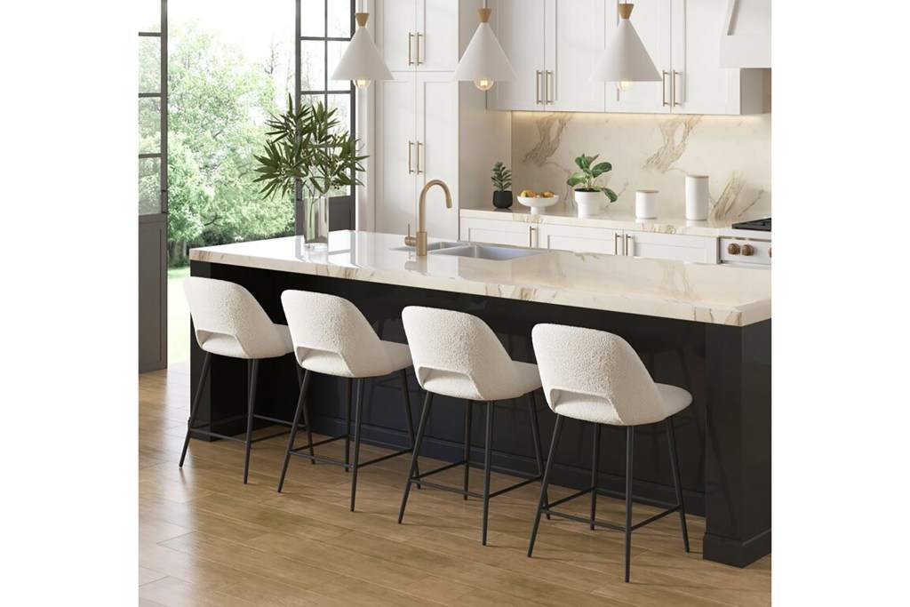 A kitchen with white cabinets and white chairs