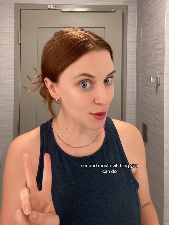 American flight attendant making a peace sign