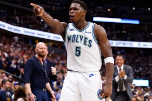 Anthony Edwards #5 of the Minnesota Timberwolves reacts to a three point basket during the fourth quarter against the Denver Nuggets in Game Seven of the Western Conference Second Round Playoffs at Ball Arena on May 19, 2024 in Denver, Colorado.