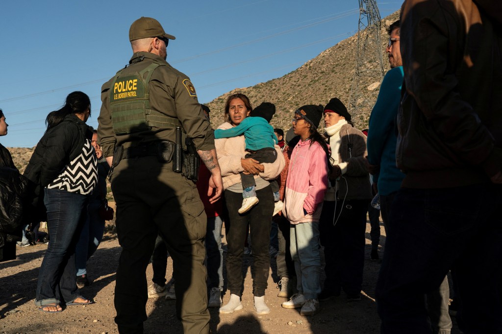 Asylum-seeking migrants gather when a U.S. Border Patrol agent told them to line up after crossing the border from Mexico into the U.S. in Jacumba Hot Springs, California, U.S. April 27, 2024. 
