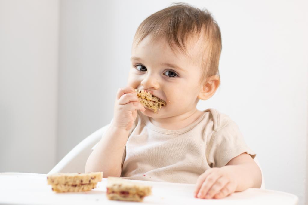 Guidelines say peanut butter can be spread thinly, or mixed with breastmilk, formula, or puree. Health officials warn that whole peanuts or chopped peanuts can cause choking hazards.