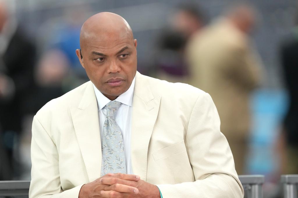 Charles Barkley in a white suit.