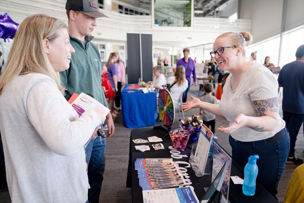 Becki and Noah Lwig speaking with Amber Ruppert at the Ottumwa Job Corps Center during a transition fair hosted by Heartland AEA.