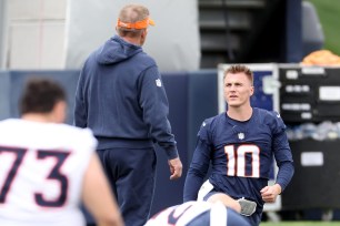 Bo Nix talks with Sean Payton.