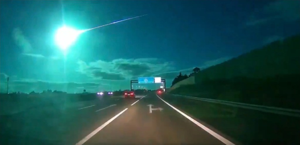 The fireball was seen streaking across the atmosphere, illuminating the overcast clouds in the night sky with a bright neon blue color for about 7 seconds.