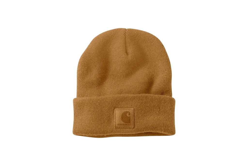 A brown knit hat with a Carhartt logo on it