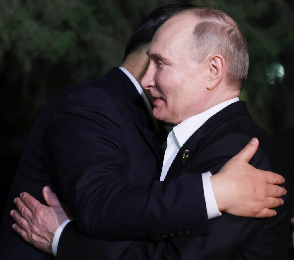 Chinese President Xi Jinping and Russian President Vladimir Putin embracing after an informal meeting in Beijing, China, on May 16, 2024.