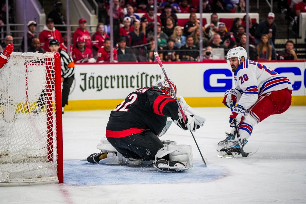 Chris Kreider #20 of the New York Rangers scores a goal against Pyotr Kochetkov #52 of the Carolina Hurricanes during the second period