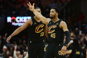 Donovan Mitchell celebrates during the Cavaliers' win over the Magic on Sunday.