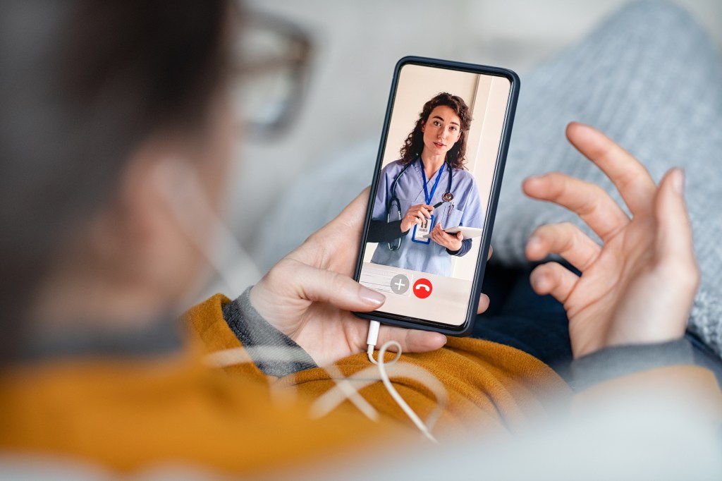 person looking at a doctor on their phone