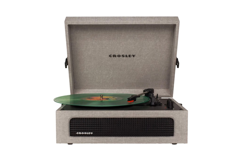 A record player with a green record