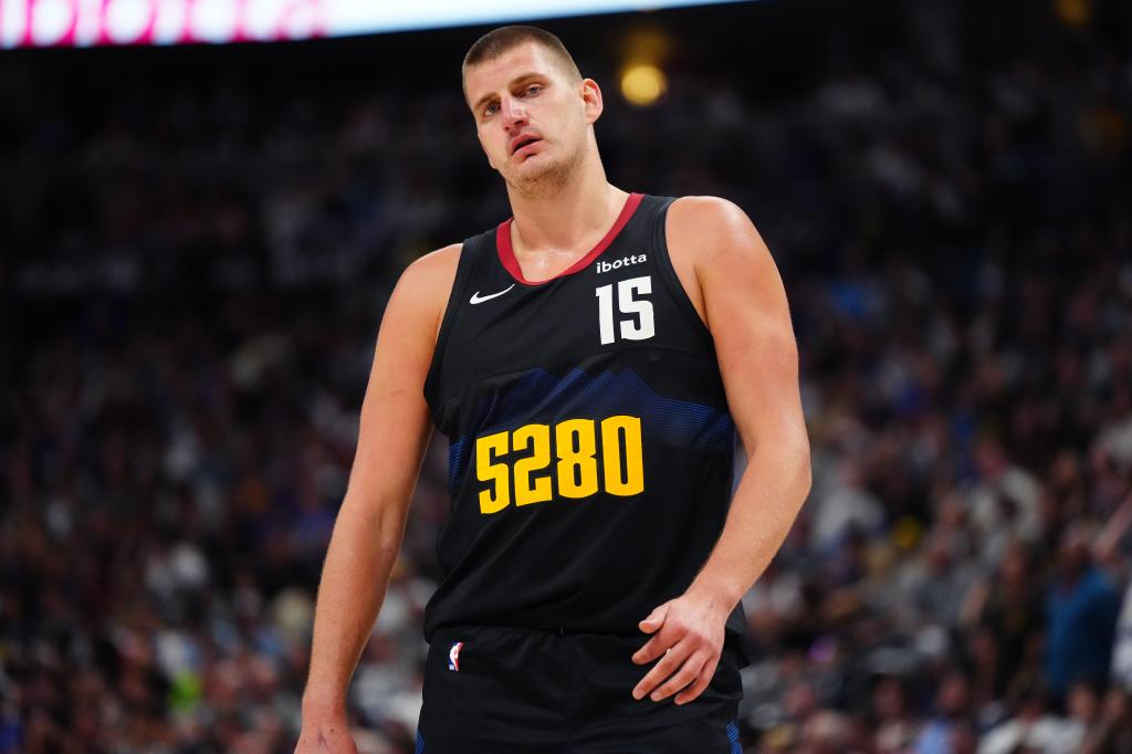 Nikola Jokic reacts during the first half against the Minnesota Timberwolves in game seven of the second round for the 2024 NBA playoffs at Ball Arena.