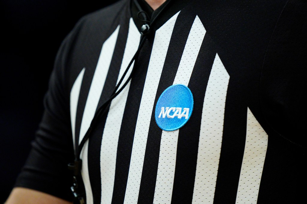 A referee wearing an NCAA patch.