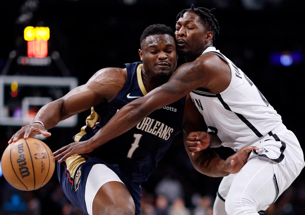 Zion Williamson #1 of the New Orleans Pelicans dribbles against Dorian Finney-Smith #28 of the Brooklyn Nets during the first half at Barclays Center on March 19, 2024 in the Brooklyn borough of New York City.