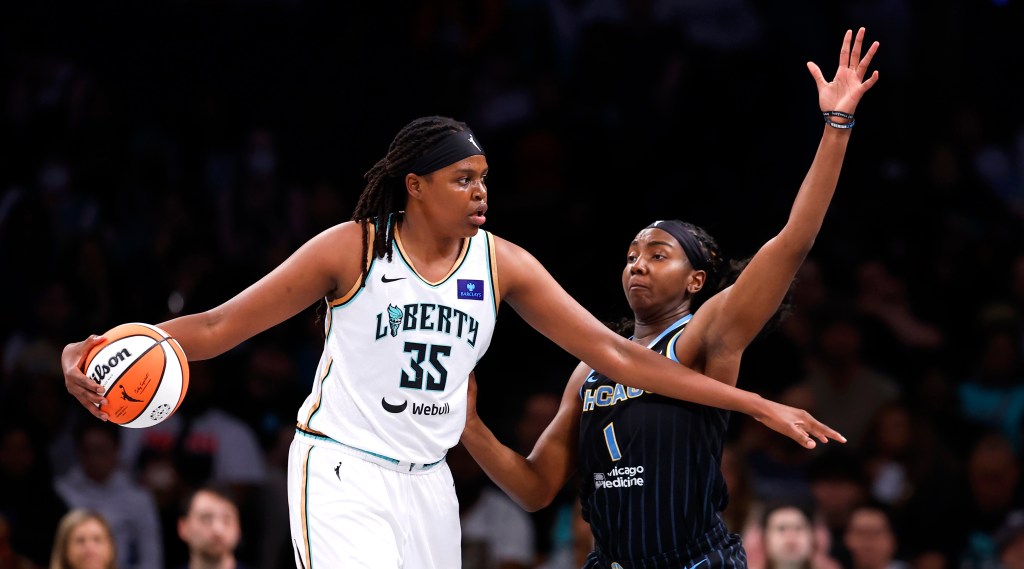 Liberty forward Jonquel Jones (35) dribbles the ball against Chicago Sky center Elizabeth Williams (1) during the first half at the Barclays Center.