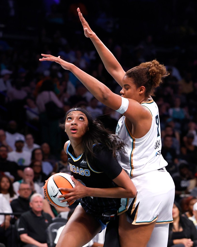Chicago Sky forward Angel Reese (5) drives to the basket against New York Liberty forward Nyara Sabally (8) during the first half at the Barclays Center.