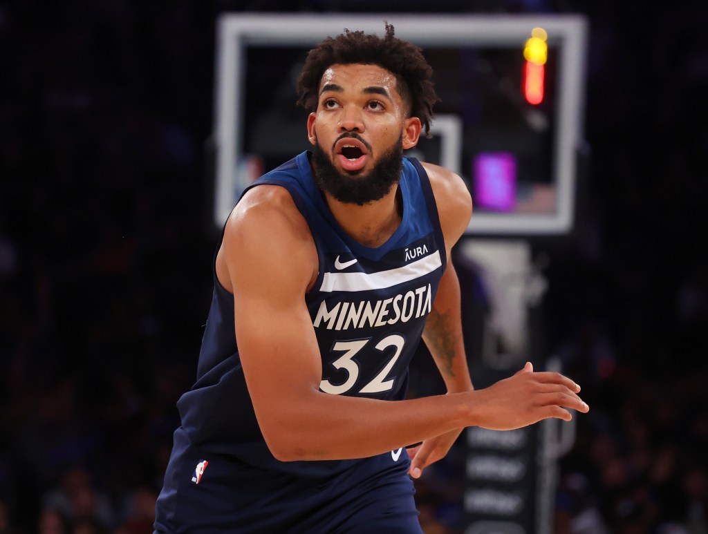 Timberwolves center Karl-Anthony Towns (32) drives down court