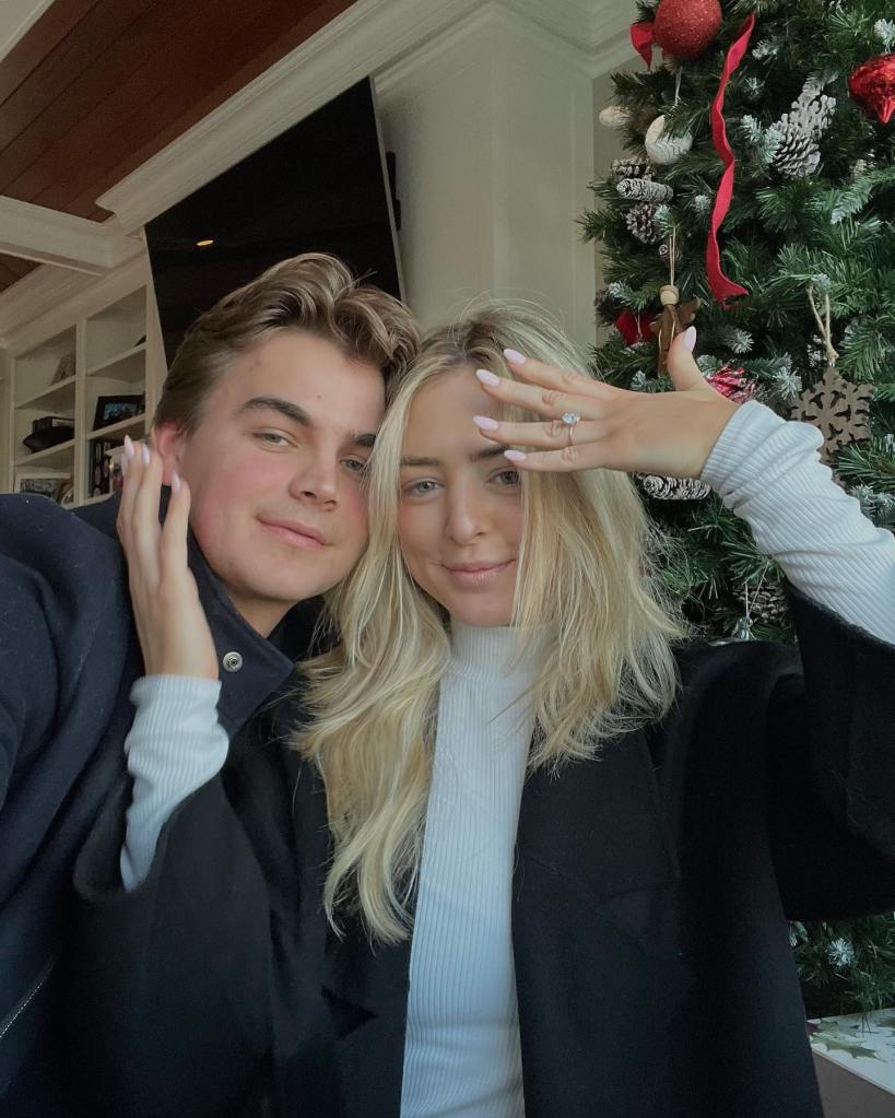 Katherine Asplundh flashes her engagement ring while posing with fiancee Cabot Asplundh