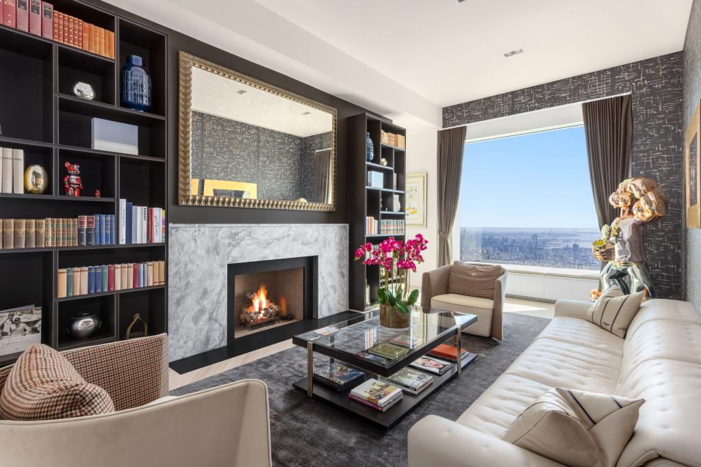 The living room with a wood-burning fireplace. 