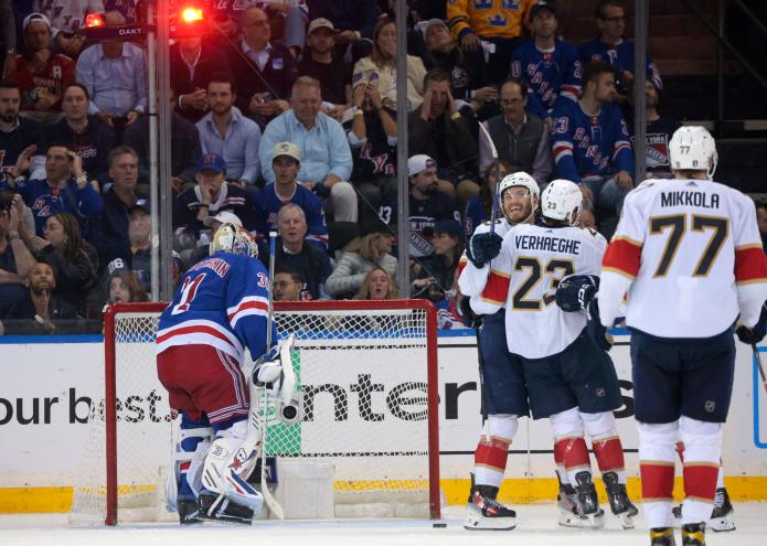 Florida Panthers team celebrating on ice after Carter Verhaeghe scores a goal during NHL Eastern Conference Finals against New York Rangers