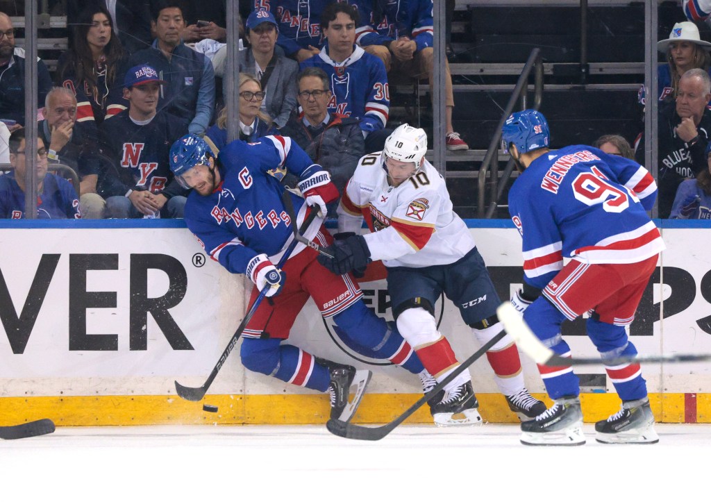 Florida Panthers right wing Vladimir Tarasenko #10 checks New York Rangers defenseman Jacob Trouba #8 during the first period on Wednesday night.
