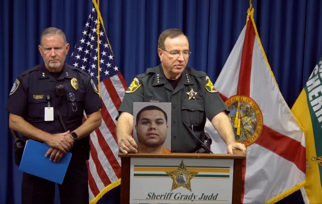 Polk County Sheriff Grady Judd holds up a photo of Fernandez at a press conference