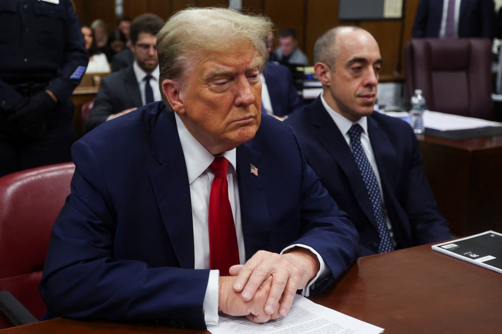 Former U.S. President Donald Trump seated at a table in Manhattan Supreme Court during his hush money trial in New York, U.S. May 16 2024.