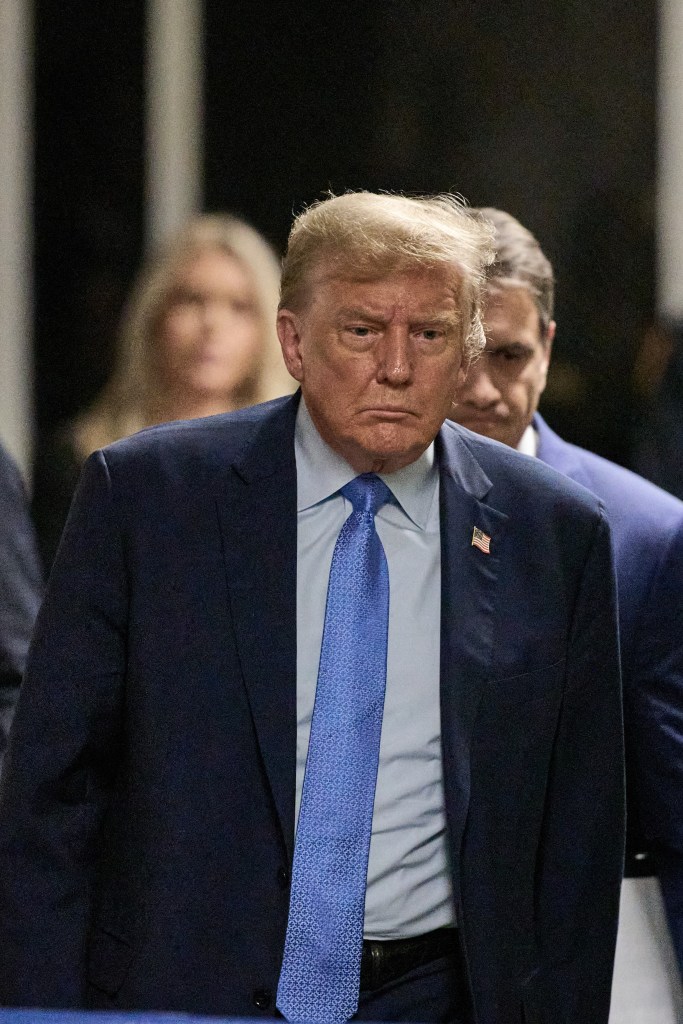 Former US President Donald Trump walks to speak to the press at the end of the day of his trial for allegedly covering up hush money payments linked to extramarital affairs, at Manhattan Criminal Court in New York City on April 26, 2024