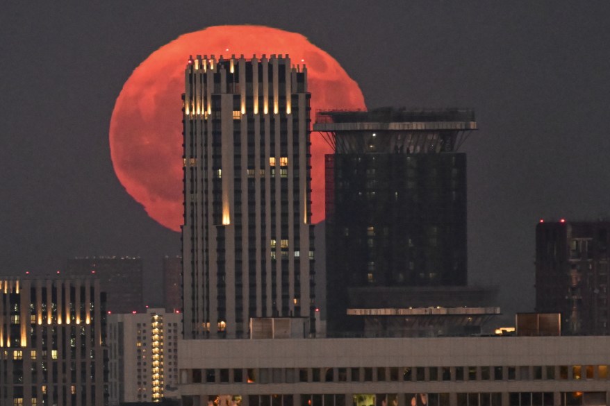 Moon appears over the Moscow, Russia.