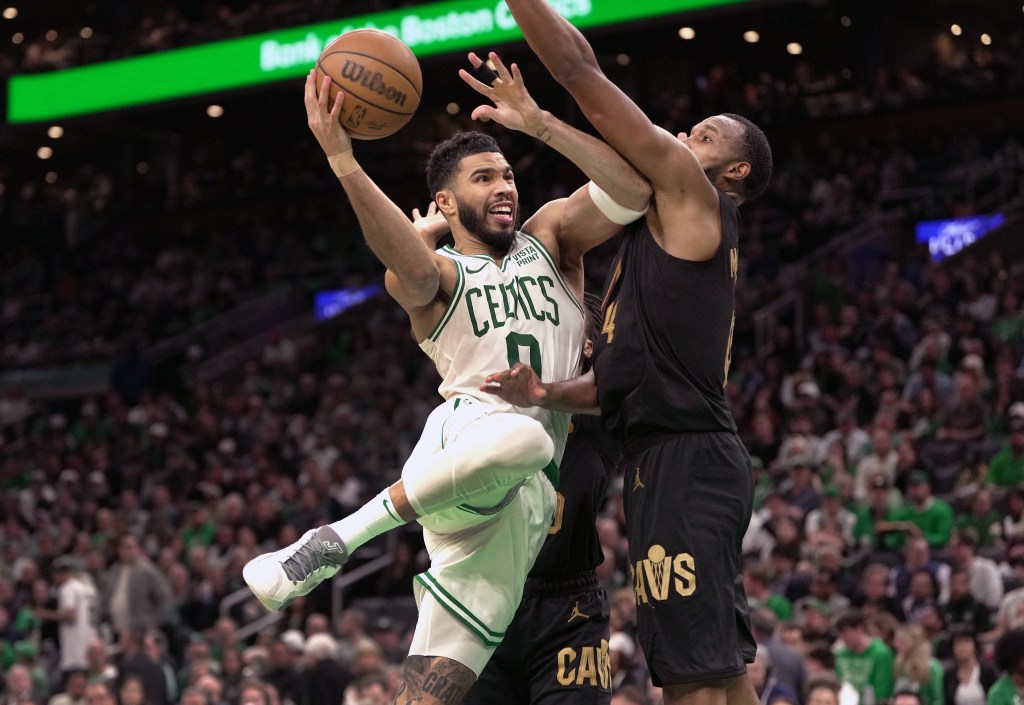 Boston Celtics forward Jayson Tatum defended by Cleveland Cavaliers forward Evan Mobley in the third quarter.
