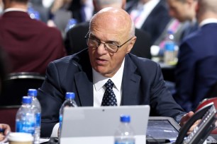 General manager Lou Lamoriello in a suit and tie at the 2022 Upper Deck NHL Draft in Montreal, Quebec