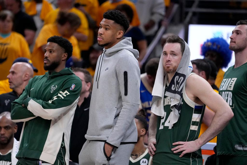 Milwaukee Bucks forward Giannis Antetokounmpo, center, and guard Pat Connaughton (24) watch from the bench during the second half against the Indiana Pacers in Game 6 in an NBA basketball first-round playoff series, Thursday, May 2, 2024, in Indianapolis. 