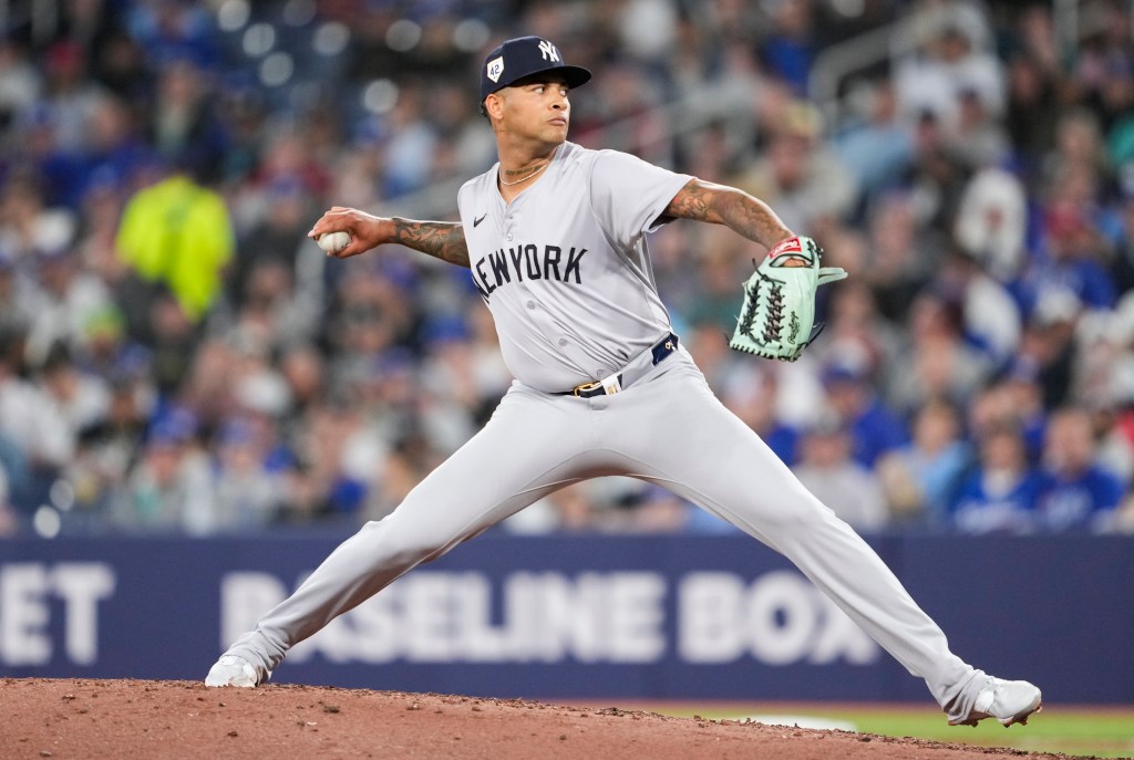 Luis Gil #81 of the New York Yankees pitches to the Toronto Blue Jays during the fifth inning in their MLB game at the Rogers Centre on April 15, 2024 in Toronto, Ontario, Canada. All players are wearing the number 42 in honor of Jackie Robinson Day. 