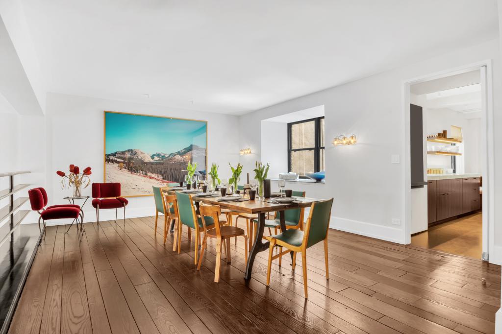 The upper floor dining area looks down on the living room.