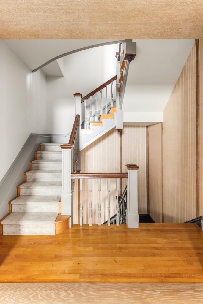 A rear staircase in the mansion, which also boasts an elevator.