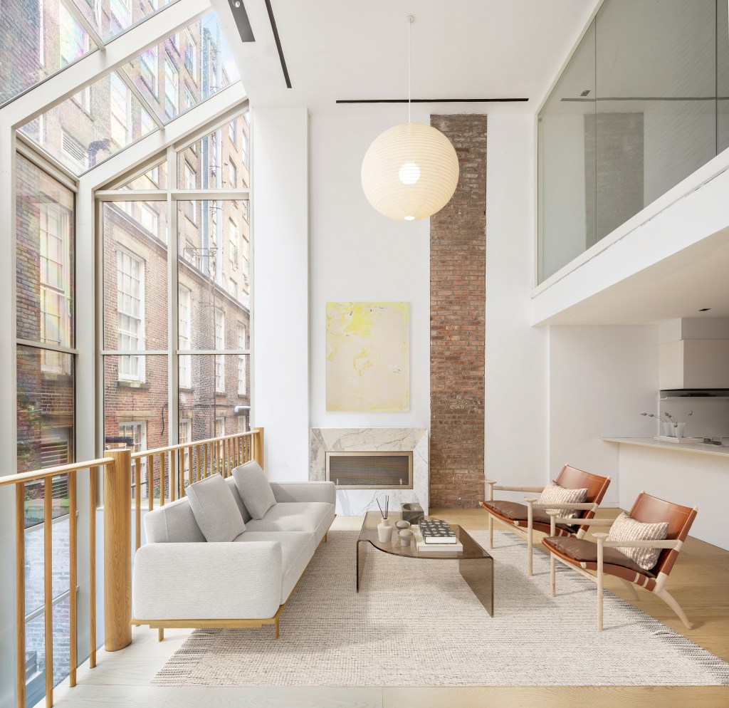 The great room comes with lofty ceiling heights in this Tribeca maisonette triplex.