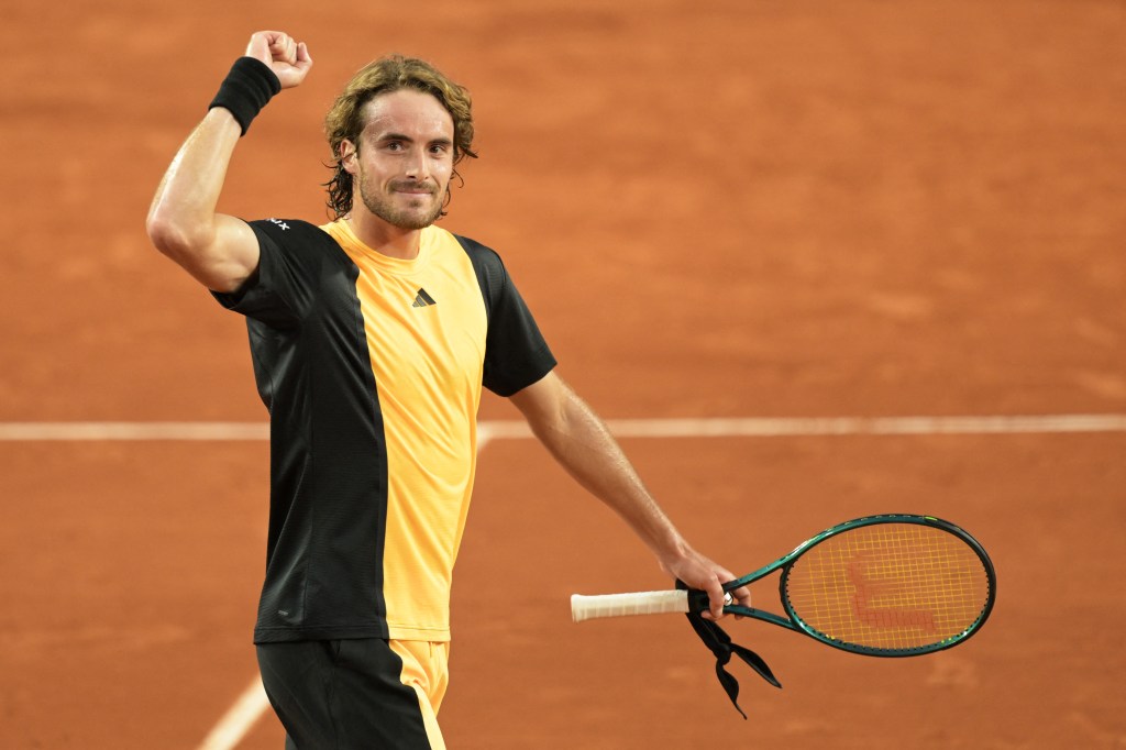 Stefanos Tsitsipas celebrates after winning his third-round French Open match on May 31, 2024.