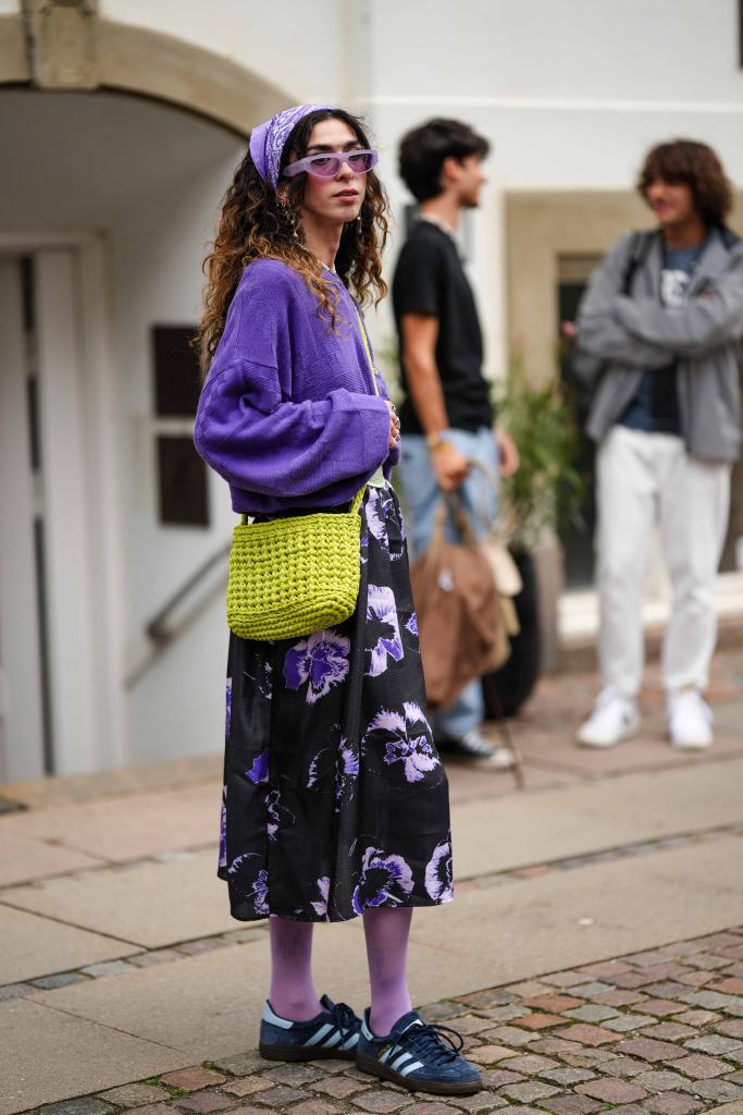 Marisa Monte dressed in a purple and black outfit with Adidas sneakers at Copenhagen Fashion Week Spring/Summer 2024