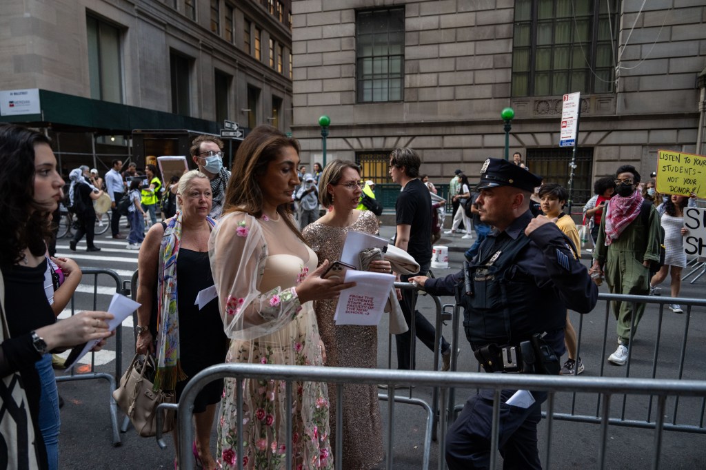 Guests arrive to the gala as protesters set up a picket line outside Cipriani Wall Street around 6:30 p.m. on Tuesday.