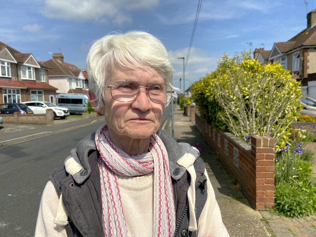 Senior woman, Hazel Speed, former Royal clerk, pictured distressed outside her waterlogged and bug-infested London home