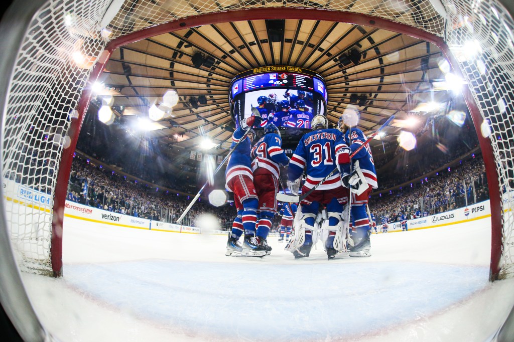 Igor Shesterkin #31 and the New York Rangers celebrate a 4-0 win to clinch the Presidents' Trophy