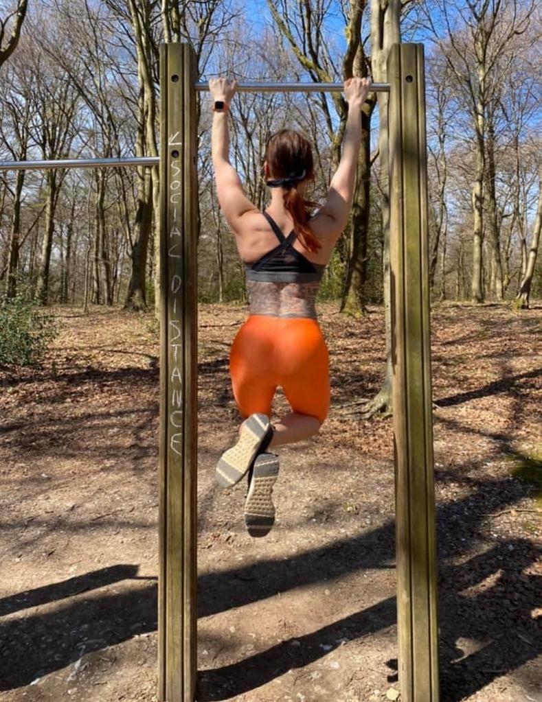 Tracy Kiss, a 36 year-old bodybuilder and mother of two, doing pull-ups despite her diagnosis with a rare joint condition.