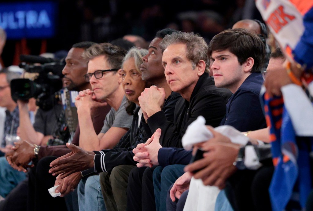 Actor Ben Stiller sits on celebrity during the second quarter.