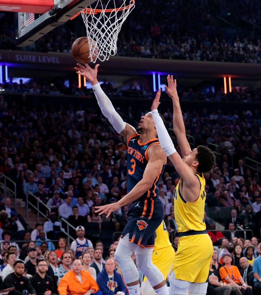 New York Knicks guard Josh Hart shooting a basketball while Indiana Pacers guard Tyrese Haliburton defends during Game 2 of the 2024 NBA Playoffs at Madison Square Garden