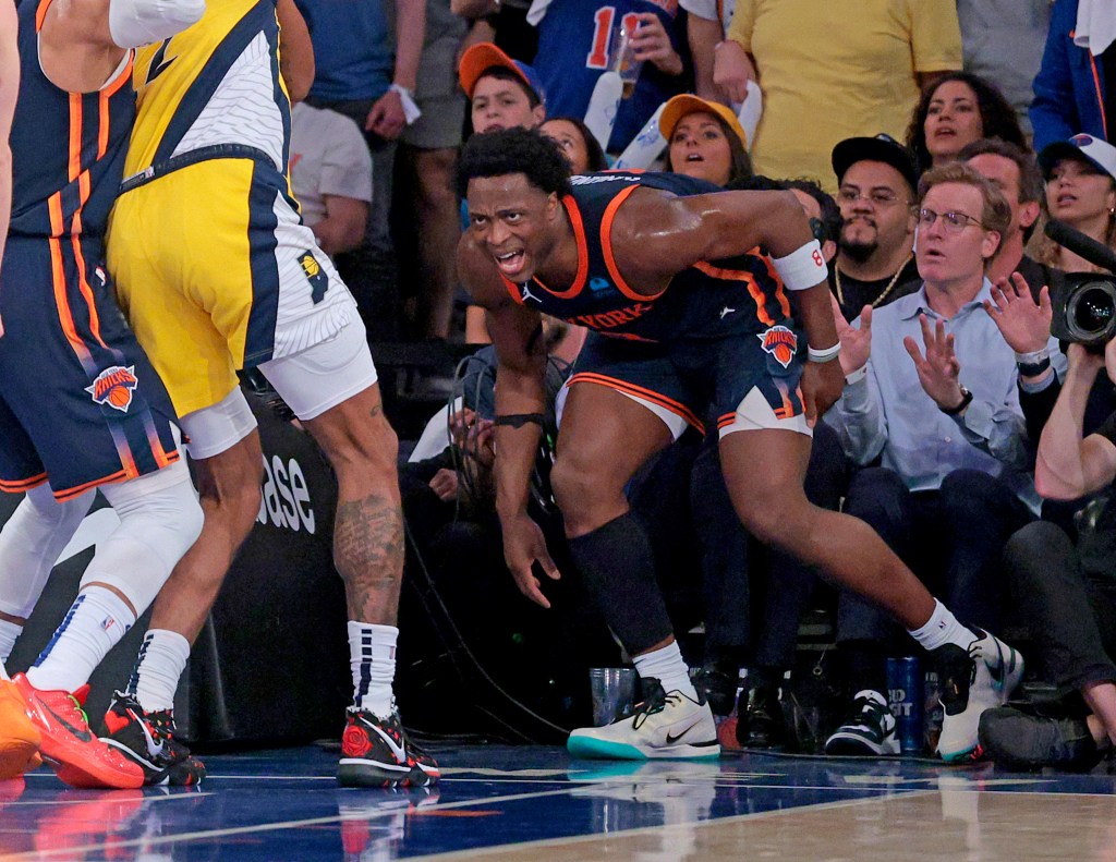 New York Knicks forward OG Anunoby #8 grabs his leg after he injuries his hamstring driving to the basket during the third quarter.