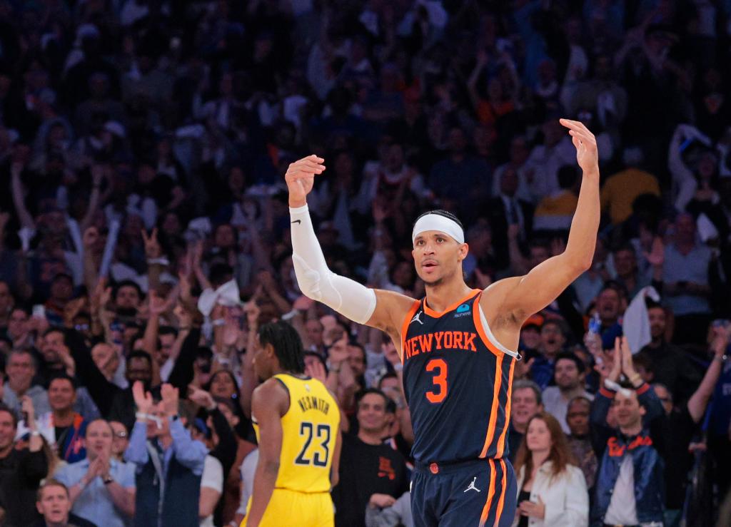 Josh Hart, guard for the New York Knicks, celebrates on the court after his team scores during the 2024 NBA Playoffs game against the Indiana Pacers at Madison Square Garden.