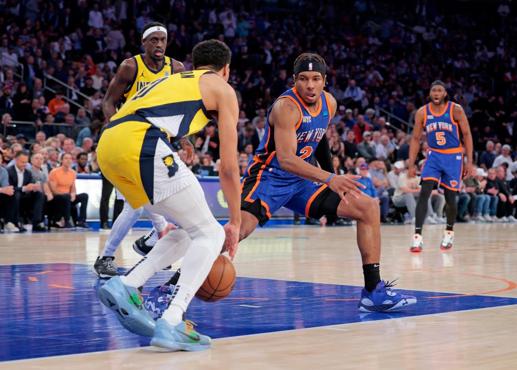 Pacers guard Tyrese Haliburton #0 drives down court as New York Knicks guard Miles McBride #2 gives chase during the second quarter.